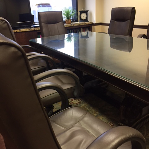 The boardroom at Herman Law with comfortable chairs